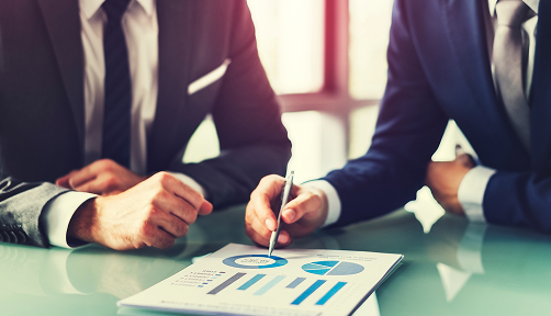 Financial advisors discussing a report